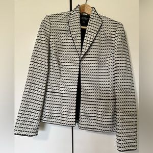 Creme and black suit jacket.